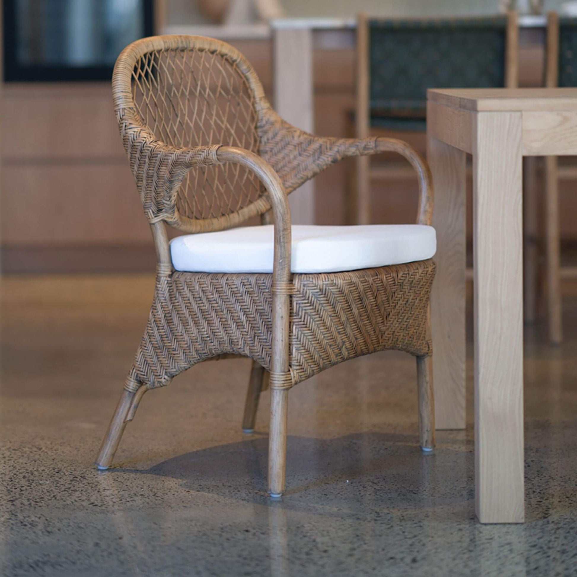 Renwick | Coastal Grey Wash Antique Brown Rattan Dining Chair With Arms | Brown
